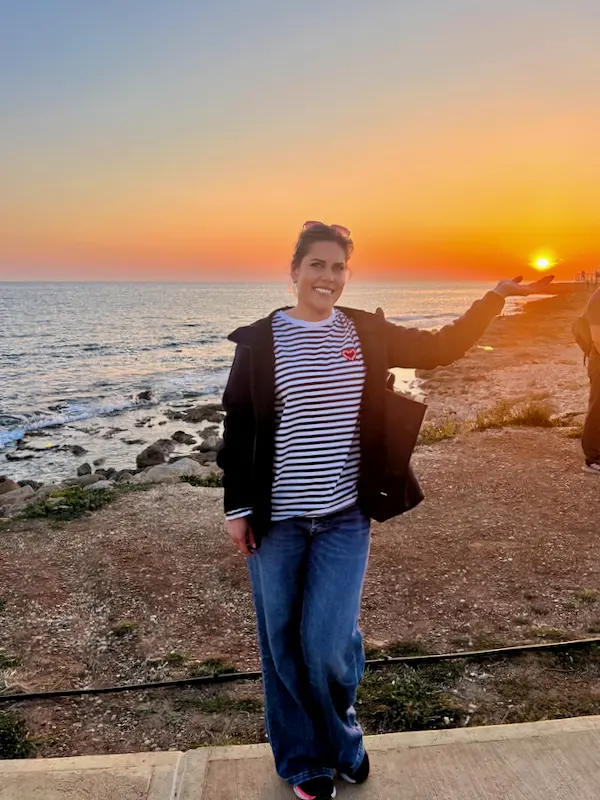 Ksenia by the sea at sunset